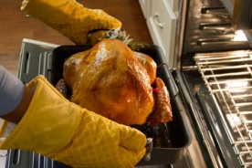 removing roast turkey from oven